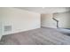 Spacious living room featuring neutral carpet, and a staircase at 743 Parc Townes Dr # 36, Wendell, NC 27591