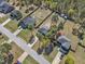 An aerial view of neighborhood showcasing properties, fences, and lush backyard landscaping at 78 Parkview Ln, Lillington, NC 27546