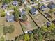 An aerial view showing several houses surrounded by green yards and large trees at 78 Parkview Ln, Lillington, NC 27546