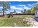 Lawn features fenced yard, treeline backdrop and adirondack chairs at 78 Parkview Ln, Lillington, NC 27546