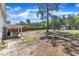 Spacious backyard with patio, fenced perimeter, storage shed, and mature landscaping at 78 Parkview Ln, Lillington, NC 27546