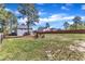 Backyard with treeline, fenced yard and a shed at 78 Parkview Ln, Lillington, NC 27546
