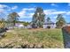 Large fenced backyard showing the home's rear, with plenty of space for recreation and relaxation at 78 Parkview Ln, Lillington, NC 27546