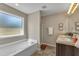 Bright bathroom features a soaking tub and double sink vanity providing a relaxing and functional space at 78 Parkview Ln, Lillington, NC 27546