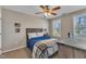 Inviting bedroom features a ceiling fan, natural light, and tasteful decor at 78 Parkview Ln, Lillington, NC 27546