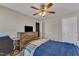 Bedroom with a ceiling fan, chest of drawers and an exterior view at 78 Parkview Ln, Lillington, NC 27546