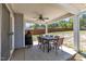 Covered patio featuring an outdoor dining set and backyard views, ideal for entertaining guests at 78 Parkview Ln, Lillington, NC 27546