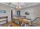 Charming dining room features a rustic wood table with a coffered ceiling and updated light fixtures at 78 Parkview Ln, Lillington, NC 27546