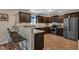 Well-lit kitchen boasts stainless steel appliances, breakfast bar, and ample cabinet space for storage at 78 Parkview Ln, Lillington, NC 27546