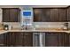 Updated kitchen features stainless steel appliances, modern sink fixtures, and ample counter space for cooking at 78 Parkview Ln, Lillington, NC 27546