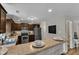 Bright, stylish kitchen featuring modern appliances, granite counters, and a convenient breakfast bar area at 78 Parkview Ln, Lillington, NC 27546