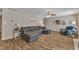 Spacious living room with a sectional sofa and wood-look flooring offers a comfortable gathering space at 78 Parkview Ln, Lillington, NC 27546