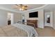Well-lit main bedroom features a bed, dresser, and a television for comfortable relaxation at 78 Parkview Ln, Lillington, NC 27546