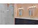 Bathroom with double vanity, gold hardware, and marble shower at 80 Greta Ln, Henderson, NC 27537