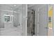 Bathroom featuring a tub, glass shower, vanity with mirrors, and neutral walls at 80 Greta Ln, Henderson, NC 27537
