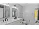 Modern bathroom featuring double sinks, a toilet, modern fixtures, and a vanity with ample counter space at 80 Greta Ln, Henderson, NC 27537