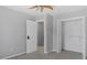 Cozy bedroom with a closet, neutral walls and carpet, and a ceiling fan at 80 Greta Ln, Henderson, NC 27537