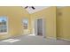 Sunny bedroom with vaulted ceiling, windows, closet and neutral carpet at 80 Greta Ln, Henderson, NC 27537