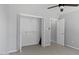 Bedroom with closet, open door, and neutral walls and carpet at 80 Greta Ln, Henderson, NC 27537