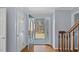 Welcoming foyer with hardwood floors, staircase, and decorative glass door with sidelight at 80 Greta Ln, Henderson, NC 27537