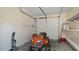 Functional garage with one car door, tools, and storage capabilities at 80 Greta Ln, Henderson, NC 27537