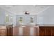 Spacious living room with hardwood floors, ceiling fan, recessed lights and french doors to the outside at 80 Greta Ln, Henderson, NC 27537