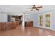 Bright living room featuring hardwood floors and access to the kitchen and outdoor patio at 80 Greta Ln, Henderson, NC 27537