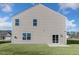 Home's backyard with sliding glass doors, ample sunlight, and a patio at 816 Canis Minor Rd, Wendell, NC 27591
