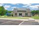 Community clubhouse featuring a modern design, well-maintained lawn, and easy access from the parking lot at 816 Canis Minor Rd, Wendell, NC 27591