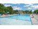 Sparkling community pool with ample lounge chairs and umbrellas for relaxing by the water at 816 Canis Minor Rd, Wendell, NC 27591