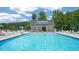 Relaxing community pool area featuring ample seating and shade for a perfect day outdoors at 816 Canis Minor Rd, Wendell, NC 27591