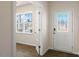Bright entryway featuring a decorative glass front door, transom window, and sidelights allowing natural light to fill the space at 816 Canis Minor Rd, Wendell, NC 27591