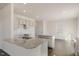 Modern kitchen featuring an island with granite countertops, stainless steel appliances, and white cabinetry at 816 Canis Minor Rd, Wendell, NC 27591