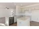 Bright kitchen with granite countertops, stainless steel appliances, white cabinets, and an island for ample counter space at 816 Canis Minor Rd, Wendell, NC 27591