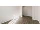 Open-concept living space featuring hardwood flooring and neutral walls, providing a versatile and inviting atmosphere at 816 Canis Minor Rd, Wendell, NC 27591
