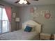 Bright bedroom with a whimsical design featuring a charming bed and decorative wall art at 860 Bear Rd, Benson, NC 27504