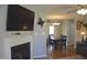 Open dining area featuring dark wood table and chairs adjacent to the living room at 860 Bear Rd, Benson, NC 27504