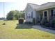 Landscaped front yard showcasing the entrance, green lawn, and curb appeal of the home at 860 Bear Rd, Benson, NC 27504