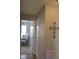 Hallway with view into Bedroom, featuring a chair and bright natural light at 860 Bear Rd, Benson, NC 27504