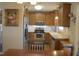 Charming kitchen featuring stainless steel appliances, wooden cabinetry, and a bright, inviting atmosphere at 860 Bear Rd, Benson, NC 27504