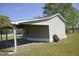 Side-angle view of the outbuilding showing drive-through awning at 860 Bear Rd, Benson, NC 27504