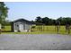 Detached outbuilding with a covered area, perfect for storage or hobbies at 860 Bear Rd, Benson, NC 27504