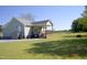 Spacious backyard with a covered porch, perfect for outdoor gatherings at 860 Bear Rd, Benson, NC 27504