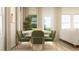 Dining area with modern table, comfortable chairs, rug, and large windows at 879 Pilot St, Haw River, NC 27258