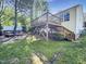 Home backyard featuring a wooden deck and mature trees at 10 Cricket Hollow Run, Clayton, NC 27520