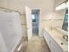 Open view of a bathroom featuring double vanity, shower-tub and flooring at 10 Cricket Hollow Run, Clayton, NC 27520