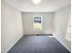 Bedroom with carpet, neutral walls and window with outside view at 10 Cricket Hollow Run, Clayton, NC 27520