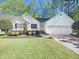 Charming one-story home with manicured lawn and attached garage with curb appeal at 10 Cricket Hollow Run, Clayton, NC 27520
