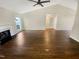 Open-concept living room featuring a fireplace, high ceilings, and lots of natural light at 10 Cricket Hollow Run, Clayton, NC 27520
