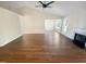Bright open-concept living room with hardwood floors, vaulted ceiling, and fireplace at 10 Cricket Hollow Run, Clayton, NC 27520